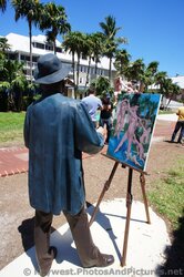 Statue of Man painting women sculptures at grounds of Key West Custom House Museum.jpg