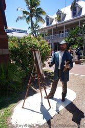 Front view of Artist painting statues at Key West Custom House Museum grounds.jpg