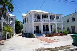 Two Story house near Southernmost Continental USA marker with wrap-around porch.jpg