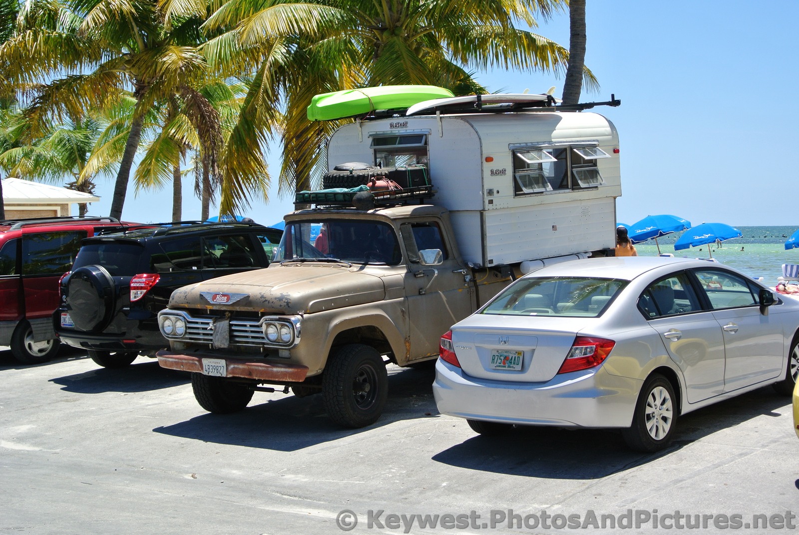 Old truck with camper parked at Higgs Beach.jpg