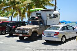 Old truck with camper parked at Higgs Beach.jpg