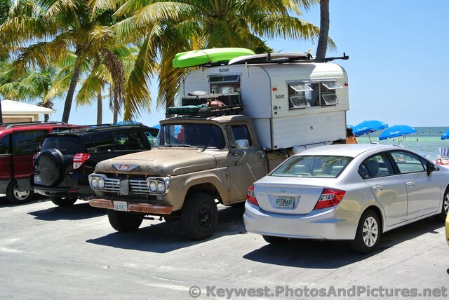 Old truck with camper parked at Higgs Beach.jpg