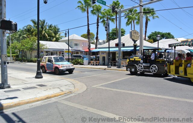 Key West Conch Tour Train turning off Duval St to Welcome Center.jpg