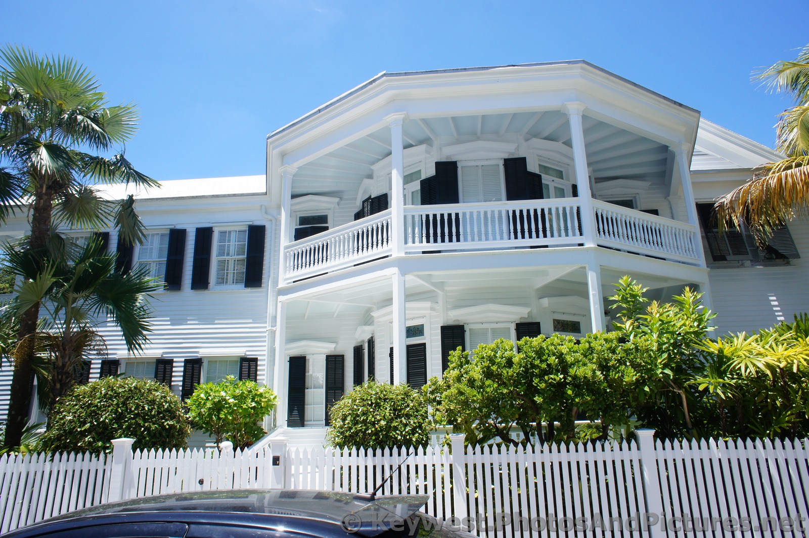 White home with second story porch in Key West.jpg