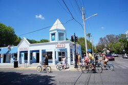 People on Bikes in front of Wendy's on Duval St Key West.jpg