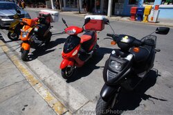 Scooters parked on Duval St Key West.jpg